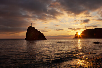 Seashore at sunset. Rock of the holy phenomenon