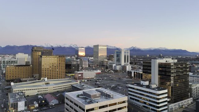 Downtown Anchorage, Alaska at twilight - Aerial HDR 4K drone footage flying forward after sunset towards buildings in downtown Anchorage