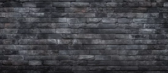Poster Im Rahmen A detailed monochrome photograph capturing the intricate pattern of grey brickwork, showcasing the composite material and rectangular shape of the black brick wall © AkuAku