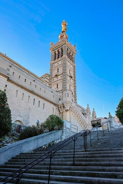 View of Notre Dame de la Garde on top of hill in Marseille. Basilica of Our Lady of Guard with morning rays of sun, Marseille, France. High quality photo