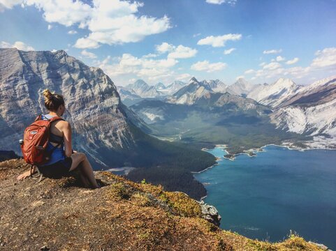 Girl looking at mountains and Lake