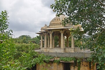 Majestic Royal Cenotaphs Amidst Verdant Greenery Under Cloudy Skies at Maharani Ki Chhatri ,Jaipur, Rajasthan, India