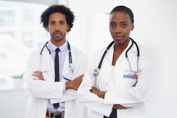 Black people, portrait and doctors with arms crossed for healthcare, confidence in medicine and team at hospital. Cardiovascular surgeon, health and medical professional collaboration with pride