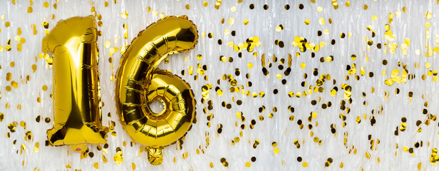 Foil balloon number and digit sixteen 16. Birthday greeting card. Golden balloons on white...