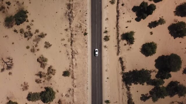 Aerial view of car driving in Thar desert, Shind, Pakistan