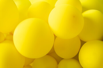 The balloons are all different shades of yellow, from light yellow to dark yellow.