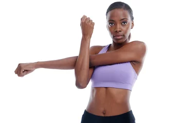 Poster Portrait, fitness and stretching with confident black woman in studio isolated on white background for workout. Exercise, health and warm up with serious young sports model at start of training © peopleimages.com