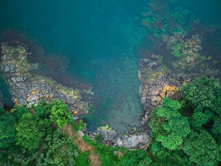 Rocky coast of the sea or ocean, top view.