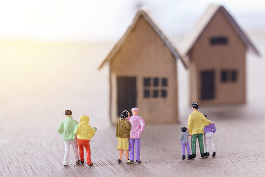Miniature people looking for house