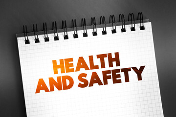 Health And Safety text on notepad, medical concept background