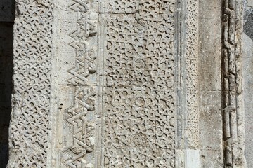 Susuz Caravanserai Anatolian Seljuk period, was built in the 13th century. It is located within the borders of Susuz village, 10 km from Bucak district. Stone motifs on the door.