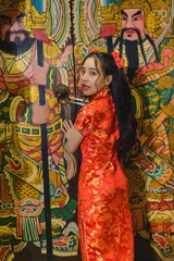 Fototapeta premium Asian beautiful woman Dress in Chinese style, Chinese New Year festival at night