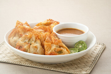 Batagor, made from fish or chicken dumpling, tofu, tapioca flour served with peanut sauce. Indonesian food
