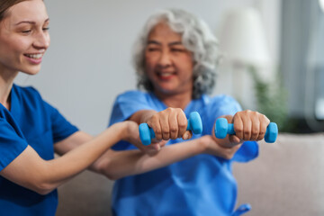 Fototapeta premium A young Caucasian physical therapist and an elderly Asian woman in her 60s attended a physical therapy course regarding muscle pain and muscle weakness. and heel pain with elastic bands