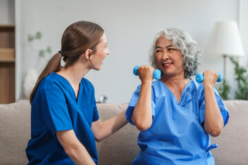A young Caucasian physical therapist and an elderly Asian woman in her 60s attended a physical...