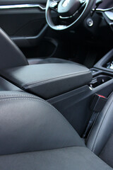 Back View Of Black Leather And Alcantara Trim On A Seats And Armrest In Car Interior
