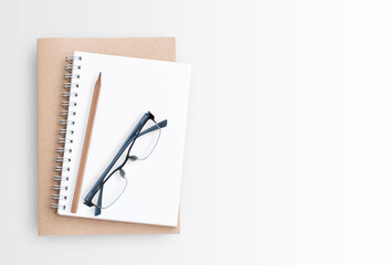 Blank paper notebook on white background.