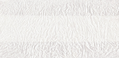 Obraz premium Light abstract background. The texture of the folds, use, crumpling of the bag, paper, cellophane. White textured background, a sheet for design, decoration, design with a place for text.