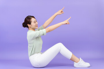 Photo of young Asian woman on purple background