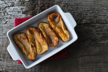 Torrijas. Typical food of Spain at Easter. Copy space. Torrijas in white tray. Top view.