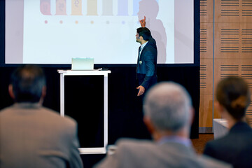 Businessman, presentation and podium with projector at conference in team meeting, staff training...