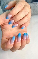 Fototapeta premium Blue Ombre Gel Nails Polish Manicure