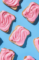 Minimalsitic pattern of pink cream on toast on bright blue background. Retro vintage breakfast aesthetic. Light pastel colors.