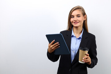 Young successful business lady using a tablet to check emails