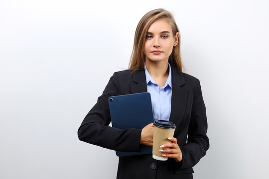 Young business woman holding a tablet for a meeting, business portrait
