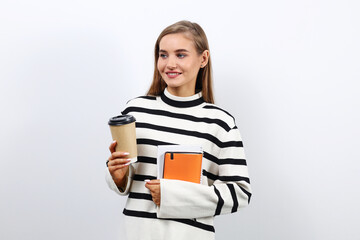 Young pretty student woman drinking coffee during a break at the university