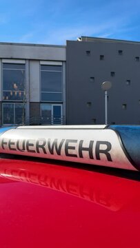 A firefighter van, marked with Feuerwehr signage on its rooftop, is parked in the central part of Kehl city near the Kultur Haus