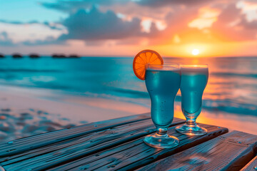 Summer cocktails on luxury tropical beach resort at sunset 