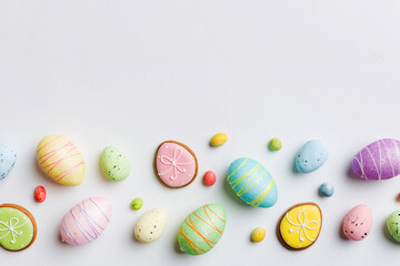 Happy Easter concept. Preparation for holiday. Easter eggs on colored background. flat lay top view copy space banner