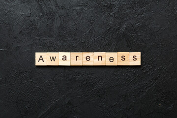 awareness word written on wood block. awareness text on table, concept