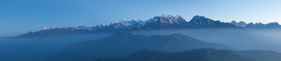 Great Himalayan Mountain range including mount Everest panorama. Landscape in Nepal in morning mist. - obrazy, fototapety, plakaty