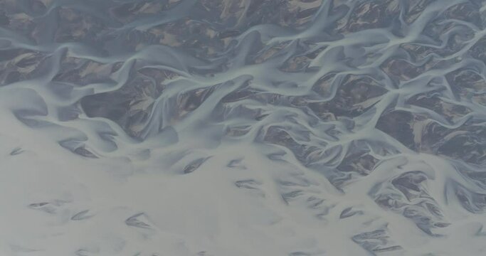 Aerial view of a glacial river water pattern, Iceland.