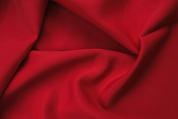 Texture of cotton fabric in red color, top view. Background, texture of draped fabric without...