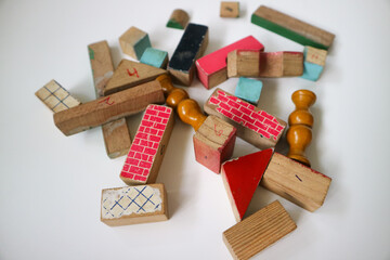 Scattered colorful wooden building blocks isolated on white background. 