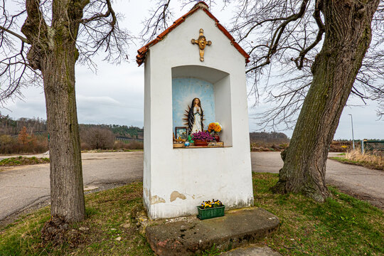 A chapel among the trees in a small village