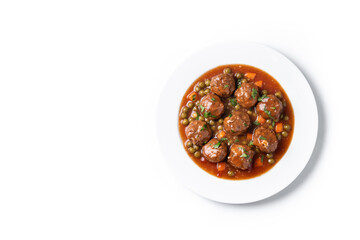 Meatballs, green peas and carrot with tomato sauce isolated on white background. Top view. Copy space