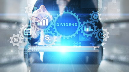 Dividends button on virtual screen. Return on Investment ROI financial business wealth concept.