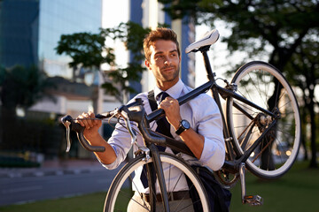 Morning, businessman and bicycle for sustainable travel, transportation and carbon footprint in city. Professional, commute and male employee walking with bike for cycling, journey or eco friendly - Powered by Adobe