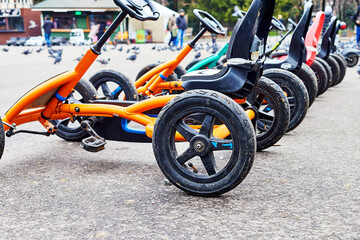 children's bicycle cars for rent in the city square