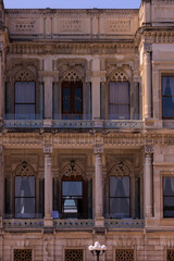 View from the water of the Bosphorus Strait to ancient palaces and buildings. Public place on the street of Istanbul, Türkiye.