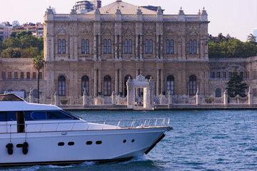 View from the water of the Bosphorus Strait to ancient palaces and buildings. Public place on the...