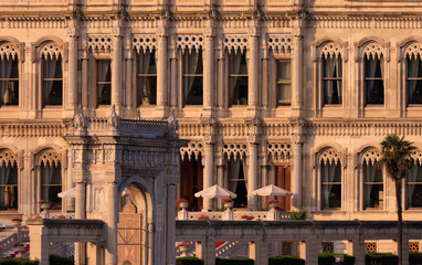 Fototapeta premium View from the water of the Bosphorus Strait to ancient palaces and buildings. Public place on the street of Istanbul, Türkiye.