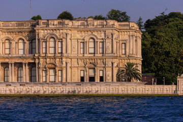 Fototapeta premium View from the water of the Bosphorus Strait to ancient palaces and buildings. Public place on the street of Istanbul, Türkiye.