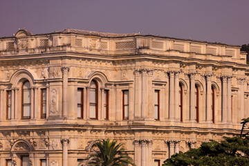 Fototapeta premium View from the water of the Bosphorus Strait to ancient palaces and buildings. Public place on the street of Istanbul, Türkiye.