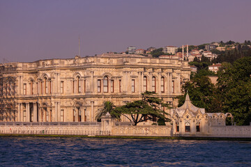 View from the water of the Bosphorus Strait to ancient palaces and buildings. Public place on the street of Istanbul, Türkiye.