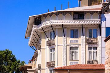 View from the water of the Bosphorus Strait to ancient palaces and buildings. Public place on the street of Istanbul, Türkiye.